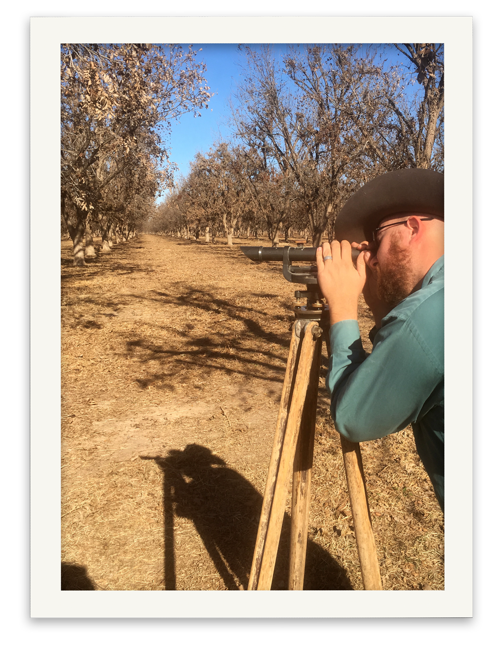 Belding Farms General Manager Zachary Swick checking the land slope before starting to irrigate.